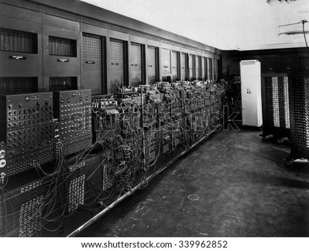 ENIAC computer was the first general-purpose electronic digital computer. 'Electronic Numerical Integrator And Computer' was 150 feet wide with 20 banks of flashing lights. Ca. 1946 Royalty-Free Stock Photo #339962852