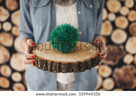 girl holding a tree ring wood background vintage retro