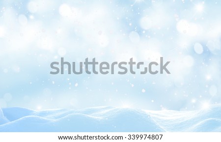 Christmas winter background with snow and blurred bokeh 