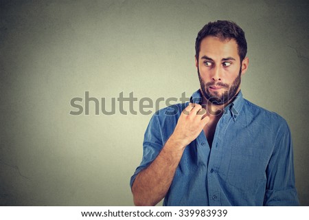 Closeup portrait, young man opening shirt to vent, it's hot, unpleasant, Awkward Situation, Embarrassment. Isolated on gray background. Negative emotions facial expression, feelings Royalty-Free Stock Photo #339983939