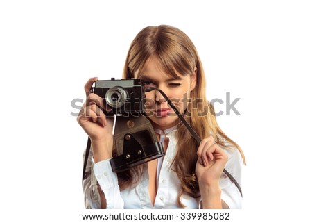 Attractive Young Woman With Vintage Photo Camera Making Shoot. Studio Photoshoot