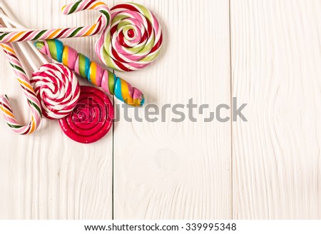 Colorful candies and sweets on wooden background,soft focus,vintage filter,christmas concept