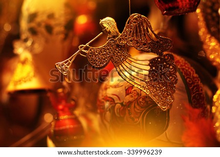 Closeup view of one beautiful christmas or new year fir tree decoration of angel toy on blurred background, horizontal picture
