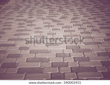 texture of old cobblestone road. tinted photo