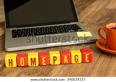 Homepage written on a wooden cube in a office desk