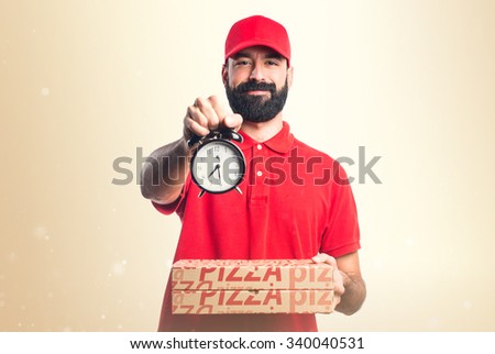 Pizza delivery man holding vintage clock
