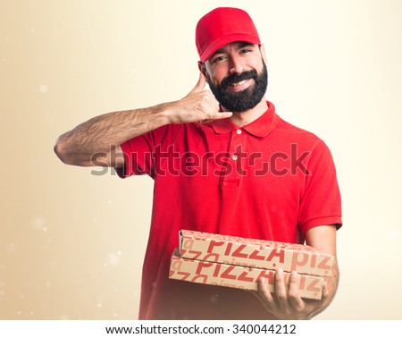 Pizza delivery man making phone gesture