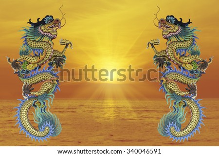 Chinese style dragon statue, blurred background sea evening before sunset.. - can be used for display your products or promotional and advertising posters.