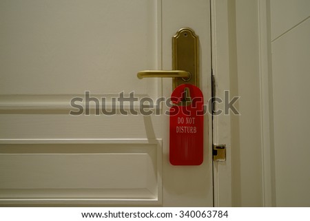 Do not disturb note on the white door
