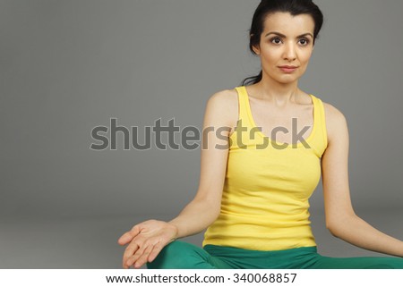 A woman in the Lotus position. Cropped view.