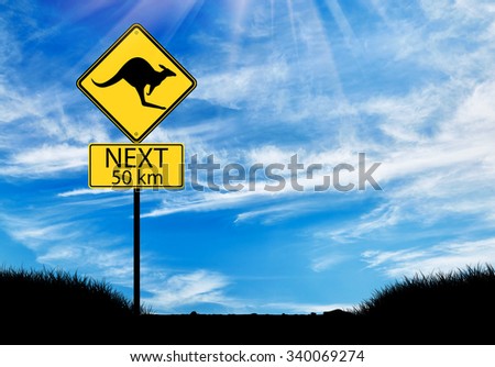 Silhouette of a kangaroo road sign against a beautiful sky