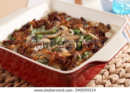 Baked green beans with caramelized onions and mushrooms on a Thanksgiving table