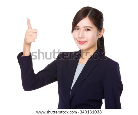 Businesswoman showing with thumb up gesture