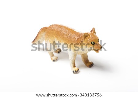 A rubber toy dog(fox)l side view isolated white.