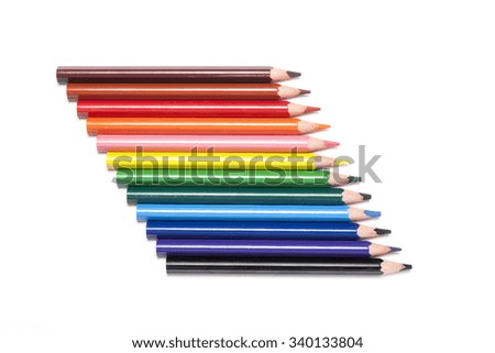 Many colorful pencil like a rainbow make diagonal line(oblique line) isolated white.