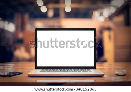 Laptop with blank screen on table. Royalty-Free Stock Photo #340152863