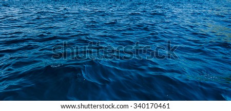 close up blue water surface at deep ocean