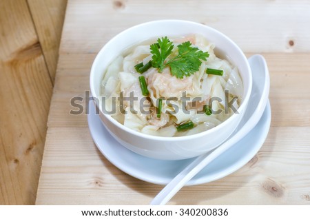 Shrimp dumplings with soup delicious, on wooden table