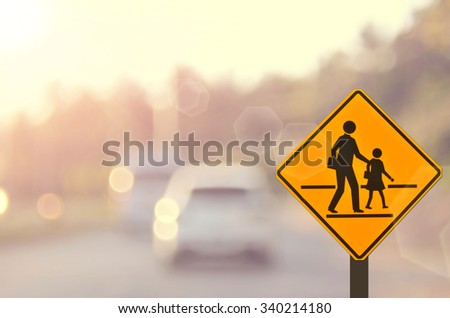 School sign.Traffic sign road on blur road abstract background.
