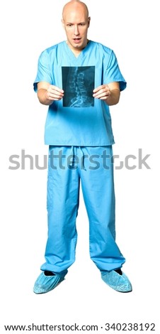 Shocked Caucasian man in uniform holding x-ray - Isolated