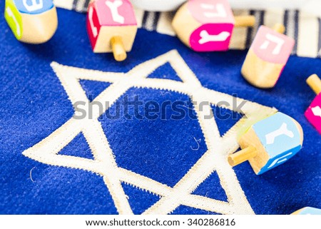 Stitched Star of David on blue banner flag.