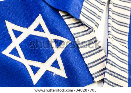 Stitched Star of David on blue banner flag.