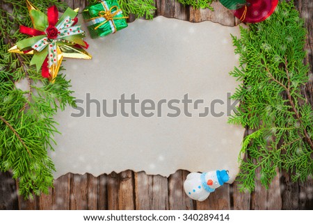 Blank Christmas card on wooden texture background with others decorating items