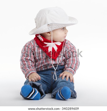 photo of little funny cowboy on white background