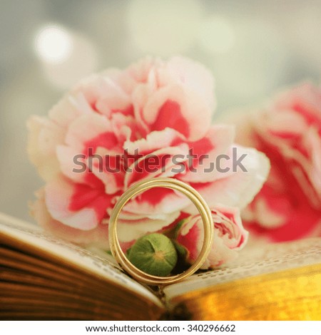 wedding ring against flower background