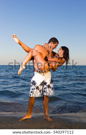 Attractive Young Couple on Tropical Beach