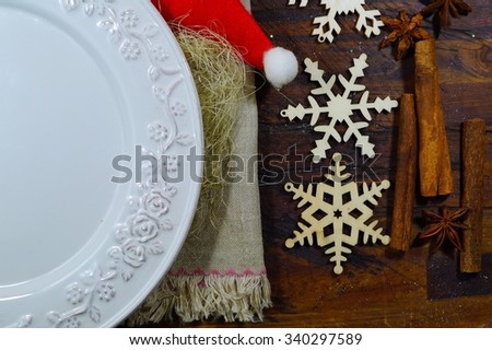 Christmas Eve wafer with decorations. The traditional Polish custom of sharing the wafer on Christmas Day.Christmas table decorated with hay on a plate.