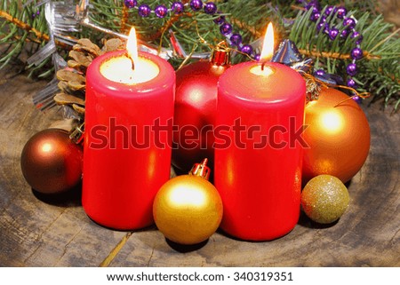 Advent candles with fir green and Christmas decoration