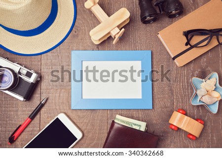 Travel and vacation concept background with blank frame and objects. View from above