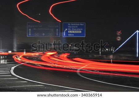 Car light trails on the highway.