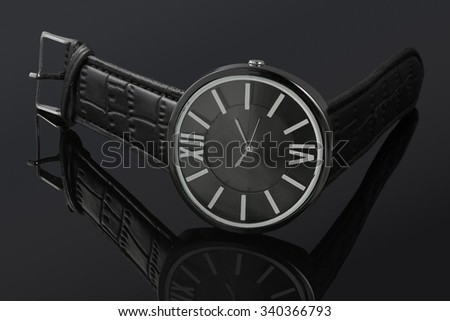 Leather man watch on the black