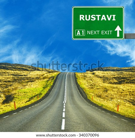 RUSTAVI road sign against clear blue sky