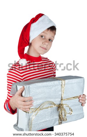 Boy in Santa hat and striped red and white pullover holding silver box isolated on white