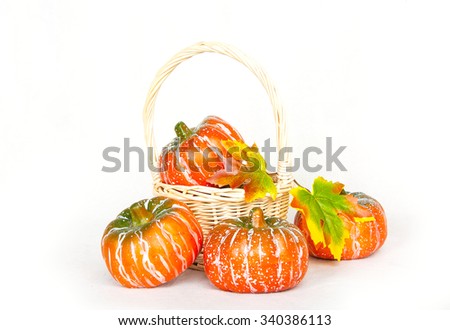 Small orange pumpkin on a white background