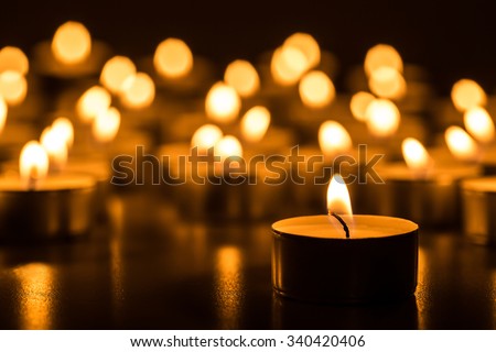 Christmas candles burning at night. Royalty-Free Stock Photo #340420406