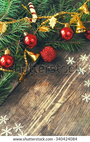 Branches of a Christmas tree on old boards. Christmas background. New Year background. Xmax background. Toning antique.