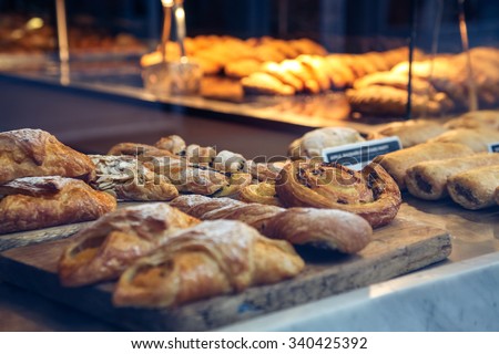 Pastries in a bakery window Royalty-Free Stock Photo #340425392