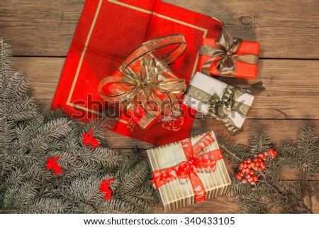 Christmas gifts on the background of the old wooden planks 