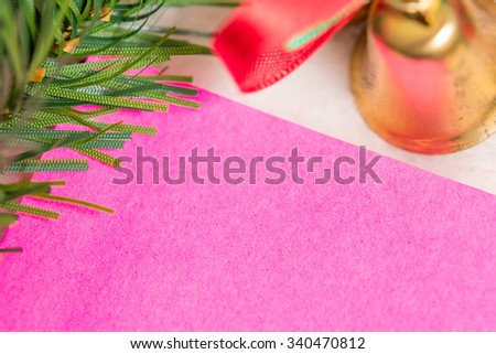 Christmas decoration with pink paper sheet on white background