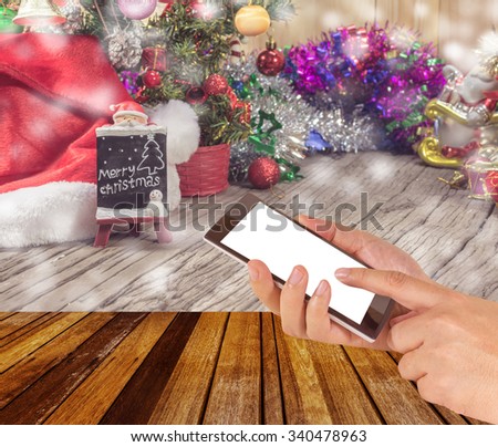 concept idea background image of hand using phone with ornaments in Christmas time .