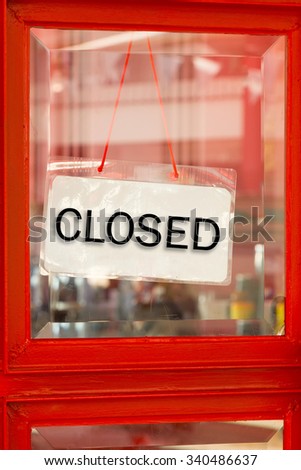 Retail and shopping image of a close sign on restaurant door.