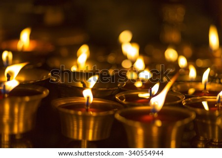 Burning candles in a temple in Kathmandu at night, Nepal (Selective focus)