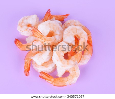 Cooked shrimps isolated on purple background.