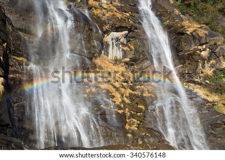 Beautiful waterfall in the forest with rainbow - Acquafraggia, Valtellina, Italia