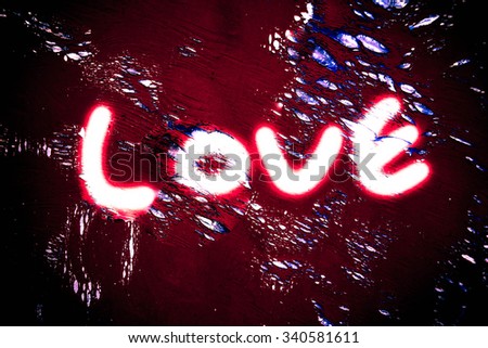Love  painted on wall background,Love concept