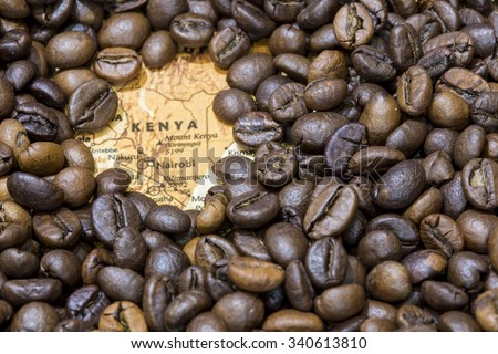 Vintage map of Kenya covered by a background of roasted coffee beans. This nation is one of the main producers and exporters of coffee. Horizontal image. Royalty-Free Stock Photo #340613810